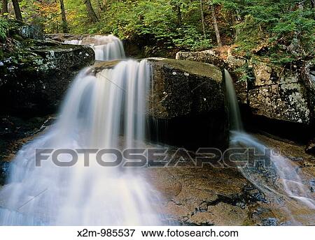 Stock Photo - Ledge Brook which is near the Kancamagus Highway route 112, which is one of New England's scenic byways located in the White Mountain National Forest of New Hampshire, USA. Fotosearch