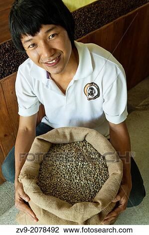 Lee Anu Chuepa is a young coffee entrepeneur speciaizling in fair-trade, organic coffee grown by his neighbors family and friends in Chiang Rai Province, and a cafe and distribution and roasting in Chiang Mai. View Large Photo Image Stock Image - Lee Anu Chuepa is a young coffee entrepeneur speciaizling in fair-trade, organic coffee grown by his neighbors family and friends in Chiang Rai Province, and a cafe and distribution and roasting in Chiang Mai.. Fotosearch