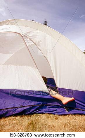 Stock Image - Leg of child on tent.. Fotosearch