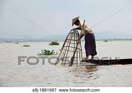 Leg-rower at fisherman, Inle Lake, Shan state, Myanmar, Burma View Large Photo Image Stock Photo - Leg-rower at fisherman, Inle Lake, Shan state, Myanmar, Burma. Fotosearch