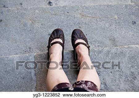 legs and feet of woman sitting on gray stone steps View Large Photo Image Stock Image - legs and feet of woman sitting on gray stone steps. Fotosearch