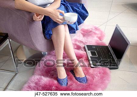 legs and feet of young girl sitting with a laptop by her feet View Large Photo Image Stock Photography - legs and feet of young girl sitting with a laptop by her feet. Fotosearch