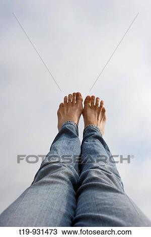 Legs and sky seen from a swing MR View Large Photo Image Stock Image - Legs and sky seen from a swing MR. Fotosearch