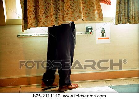 Legs of a man behind a curtain looking out the window from inside a passenger boat. View Large Photo Image Stock Image - Legs of a man behind a curtain looking out the window from inside a passenger boat.. Fotosearch