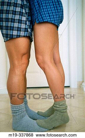 Legs of couple kissing View Large Photo Image Stock Photo - Legs of couple kissing. Fotosearch