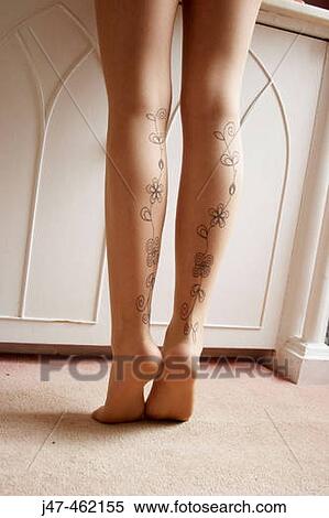 Stock Photography - Legs of girl in fancy stockings. Fotosearch