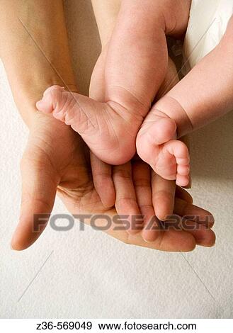 Stock Photo - Legs of one week old girl. Fotosearch