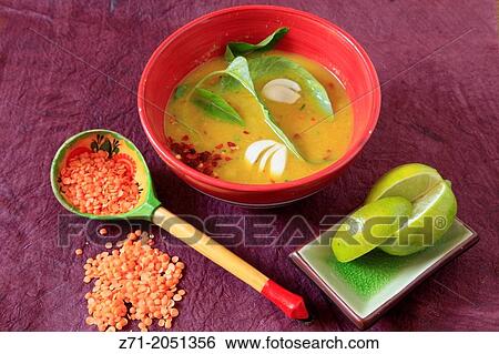Stock Photograph - Lentil soup with water spinach, garlic and lime.. Fotosearch