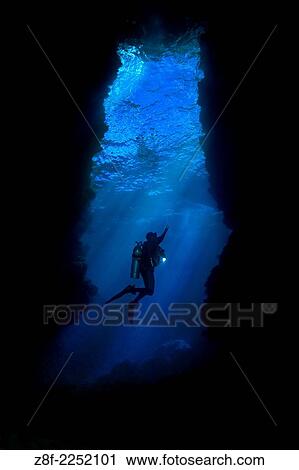 Leru Cut, Russell Islands, Solomon Islands, Aboard Spirit of the Solomons, Famous Divesite for light streaming from cuts at top of the cave. View Large Photo Image Stock Image - Leru Cut, Russell Islands, Solomon Islands, Aboard Spirit of the Solomons, Famous Divesite for light streaming from cuts at top of the cave.. Fotosearch