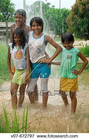 Leticia, Patricia, Claudesi and Eleigi, in Baliza, Roraima, one day of tropical rain. Brazil. View Large Photo Image Stock Photo - Leticia, Patricia, Claudesi and Eleigi, in Baliza, Roraima, one day of tropical rain. Brazil.. Fotosearch