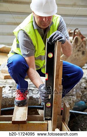 Level, hand tools for construction, construction worker, Preparation of formwork for construction of pit with concrete, House Construction, Basque Country, Spain View Large Photo Image Stock Photography - Level, hand tools for construction, construction worker, Preparation of formwork for construction of pit with concrete, House Construction, Basque Country, Spain. Fotosearch