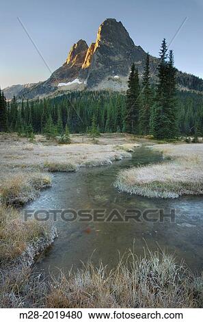 Liberty Bell Mountain at sunrise from meadows of Washington Pass, North Cascades Washington. View Large Photo Image Stock Image - Liberty Bell Mountain at sunrise from meadows of Washington Pass, North Cascades Washington.. Fotosearch