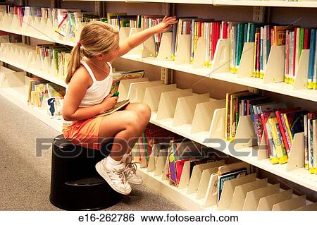 Library girl View Large Photo Image Stock Photograph - Library girl. Fotosearch