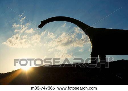 Stock Photography - Life size replica of sauropod dinosaur in Villar del Rio. Soria province, Castilla-Leon, Spain. Fotosearch