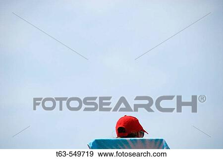 lifeguard sitting in lifeguard chair at beach View Large Photo Image Stock Photo - lifeguard sitting in lifeguard chair at beach. Fotosearch