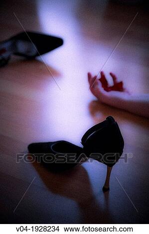 Lifeless body and high heeled shoes at a murder scene View Large Photo Image Picture - Lifeless body and high heeled shoes at a murder scene. Fotosearch