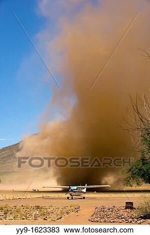 Light aircraft and dust devil. NamibRand Nature Reserve, Hardap Region, Namibia View Large Photo Image Stock Image - Light aircraft and dust devil. NamibRand Nature Reserve, Hardap Region, Namibia. Fotosearch