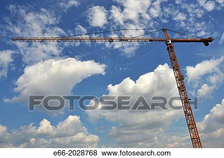 light blue sky with clouds with building crane running horizontally through the image. View Large Photo Image Stock Photo - light blue sky with clouds with building crane running horizontally through the image.. Fotosearch