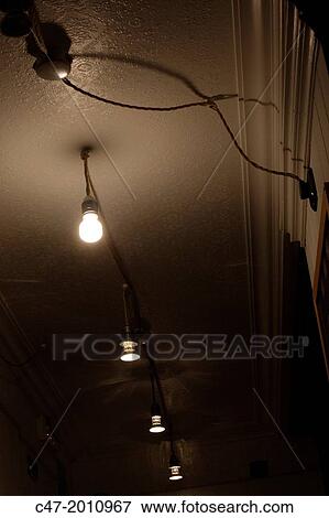 Stock Photo - Light bulbs in corridor. Fotosearch
