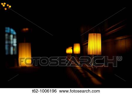 Lighted lamps inside a room View Large Photo Image Stock Photograph - Lighted lamps inside a room. Fotosearch