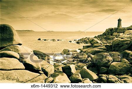 Stock Image - lighthouse and coast landscape Ploumanach Pink granite coast Perros-Guirec Breton: Perroz-Gireg is a commune in the C? tes-d? Armor department in Bretagne in northwestern France. Fotosearch