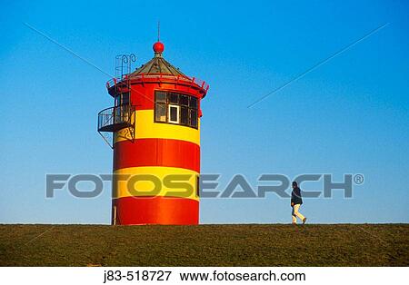 Stock Photo - Lighthouse, Pilsum, Lower Saxony, Germany. Fotosearch