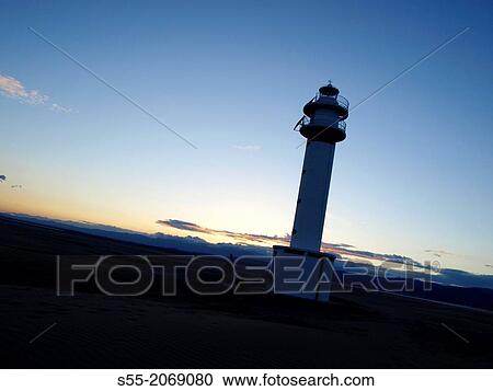 Stock Image - Lighthouse, Punta del Fangar. Natural Park of Delta del Ebro, Tarragona, Catalonia, Spain.. Fotosearch