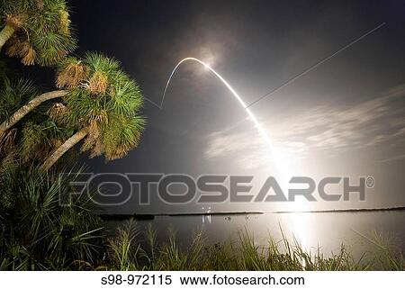 Lighting Up the Night Viewed from the Banana River Viewing Site at NASA? s Kennedy Space Center in Florida, space shuttle Discovery arcs through a cloud-brushed sky, lighted by the trail of fire after launch on the STS-128 mission View Large Photo Image Stock Photography - Lighting Up the Night Viewed from the Banana River Viewing Site at NASA? s Kennedy Space Center in Florida, space shuttle Discovery arcs through a cloud-brushed sky, lighted by the trail of fire after launch on the STS-128 mission. Fotosearch