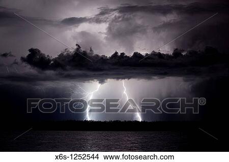 Picture - Lightning in Illa de Buda, Natural Park of Delta de l? Ebre, Tarragona, Spain. Fotosearch