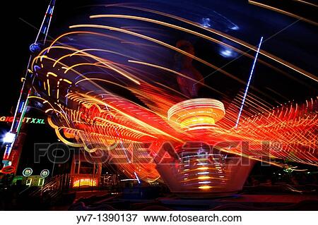 Stock Photo - Lights and abstractions in the night fair. Fotosearch