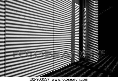 Stock Photo - Lights and shadows on the wall Inside Lines Black and white. Fotosearch