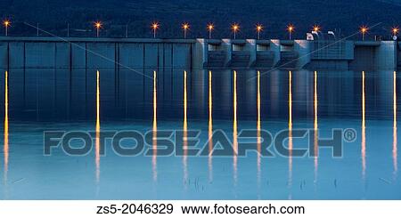 Lights of a dam at sunset from Bellus swamp in Valencia, Comunidad Valenciana, Spain, Europe. View Large Photo Image Stock Photo - Lights of a dam at sunset from Bellus swamp in Valencia, Comunidad Valenciana, Spain, Europe.. Fotosearch
