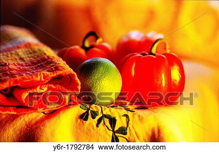 Picture - Lime, pepper and knapkin on Irish linen tablecloth in front of a window in London. Fotosearch