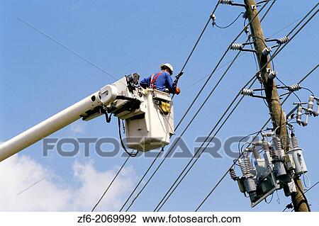 Lineman repairing hurricane damage in Florida in 2004. View Large Photo Image Stock Image - Lineman repairing hurricane damage in Florida in 2004.. Fotosearch