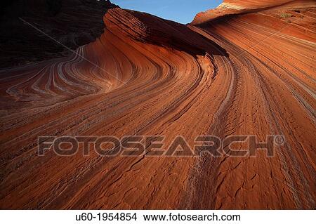 Lines and swirls form in the sandstone landscape at Coyote Buttes North. View Large Photo Image Picture - Lines and swirls form in the sandstone landscape at Coyote Buttes North.. Fotosearch