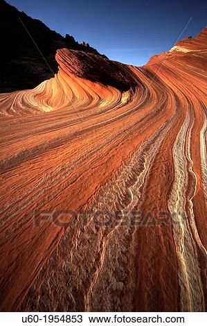 Stock Image - Lines and swirls form in the sandstone landscape at Coyote Buttes North.. Fotosearch