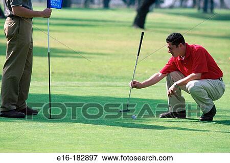 Stock Photo - Lining up putt. Fotosearch