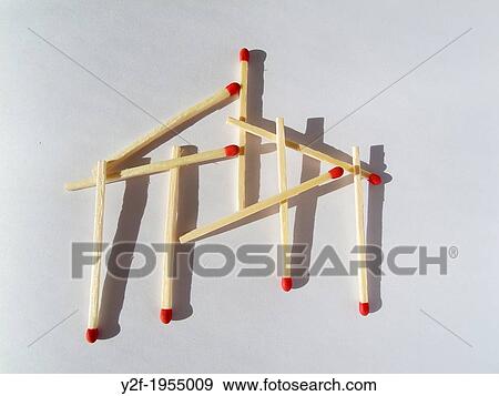 Stock Photo - linked matches and shadows on white book.. Fotosearch