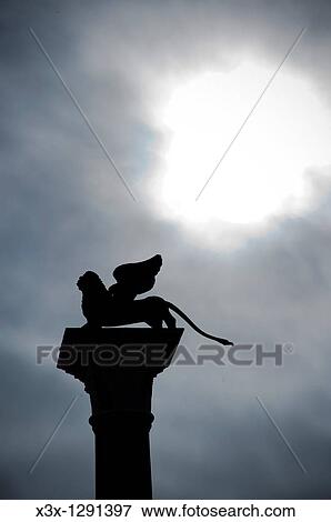 Stock Photo - Lion statue side profile St Mark square Venice Italy. Fotosearch