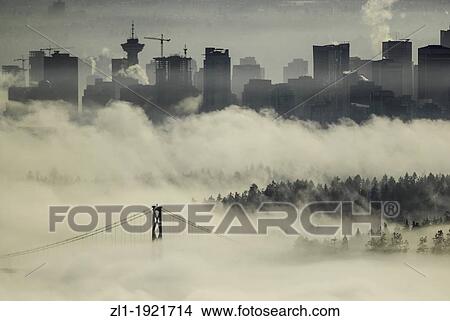Picture - Lions Gate bridge view from Cypress mountain lookout In the fog Vancouers Highrises in the background. Fotosearch