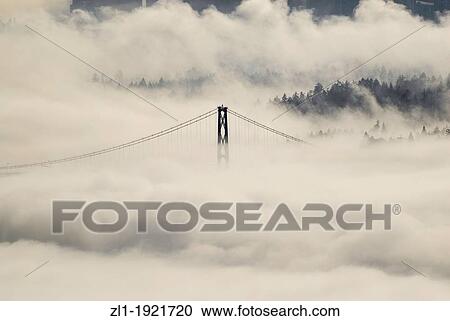 Lions Gate bridge view from Cypress mountain lookout In the fog Vancouers Highrises in the background View Large Photo Image Stock Image - Lions Gate bridge view from Cypress mountain lookout In the fog Vancouers Highrises in the background. Fotosearch