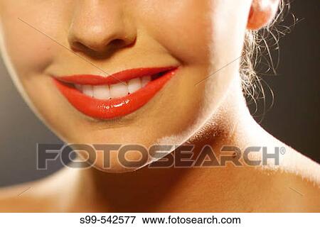 Lipstick close-up on lips View Large Photo Image Stock Photo - Lipstick close-up on lips. Fotosearch