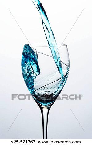 Stock Photo - Liquid pouring into a glass. Fotosearch
