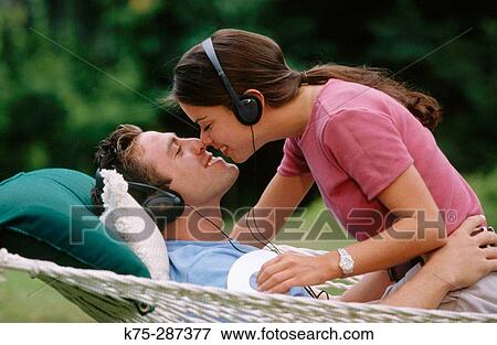 listening to music and kissing View Large Photo Image Stock Photo - listening to music and kissing. Fotosearch