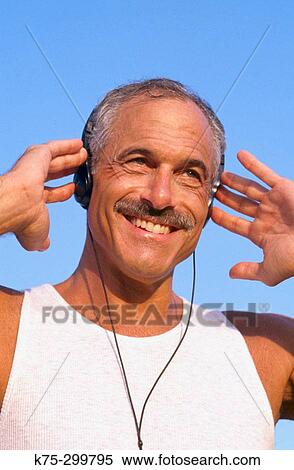 listening to music on headsets View Large Photo Image Stock Photography - listening to music on headsets. Fotosearch