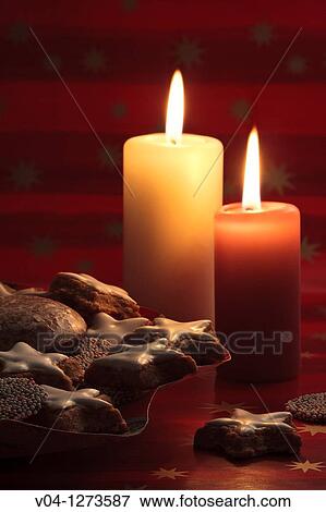 Lit candles and lots of christmas cookies View Large Photo Image Stock Photo - Lit candles and lots of christmas cookies. Fotosearch