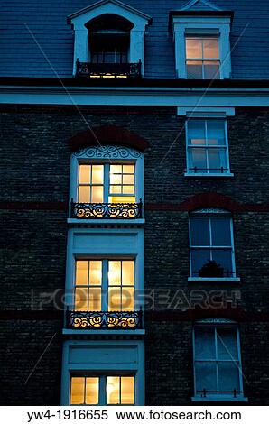 Lit windows at dusk, Chelsea Bridge Road, London, SW3, UK View Large Photo Image Stock Photography - Lit windows at dusk, Chelsea Bridge Road, London, SW3, UK. Fotosearch