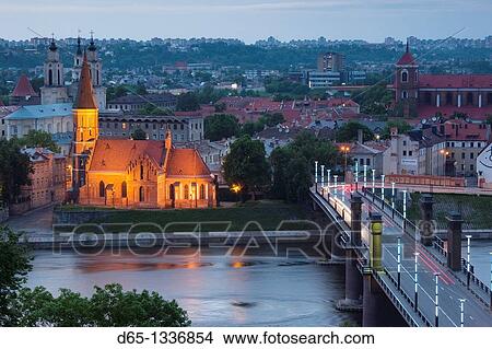Picture - Lithuania, Central Lithuania, Kaunas, elevated view of Vytautas Church and Aleksoto tiltas bridge, dusk. Fotosearch