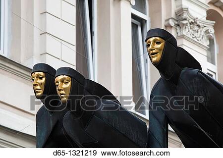 Stock Photo - Lithuania, Vilnius, Three Muses sculpture atop Lithuanian National Drama Theater. Fotosearch