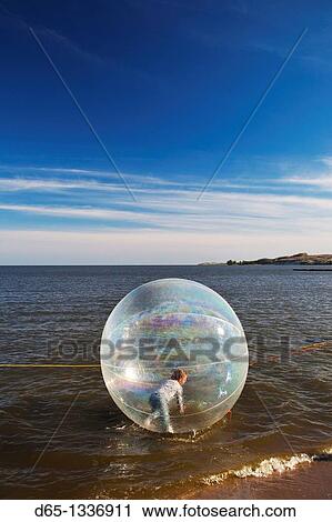 Lithuania, Western Lithuania, Curonian Spit, Nida, kids in waterball, NR View Large Photo Image Stock Image - Lithuania, Western Lithuania, Curonian Spit, Nida, kids in waterball, NR. Fotosearch